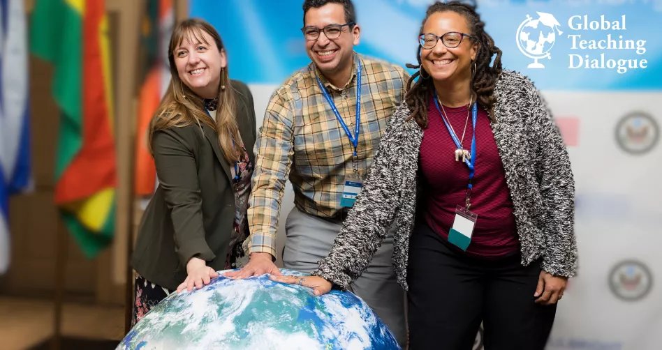 three people in front of a globe with the words Global Teaching Dialogue