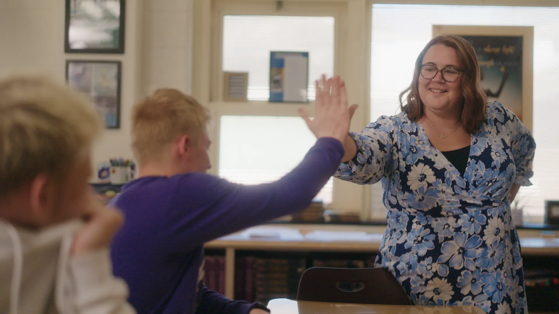 a student high fives their teacher